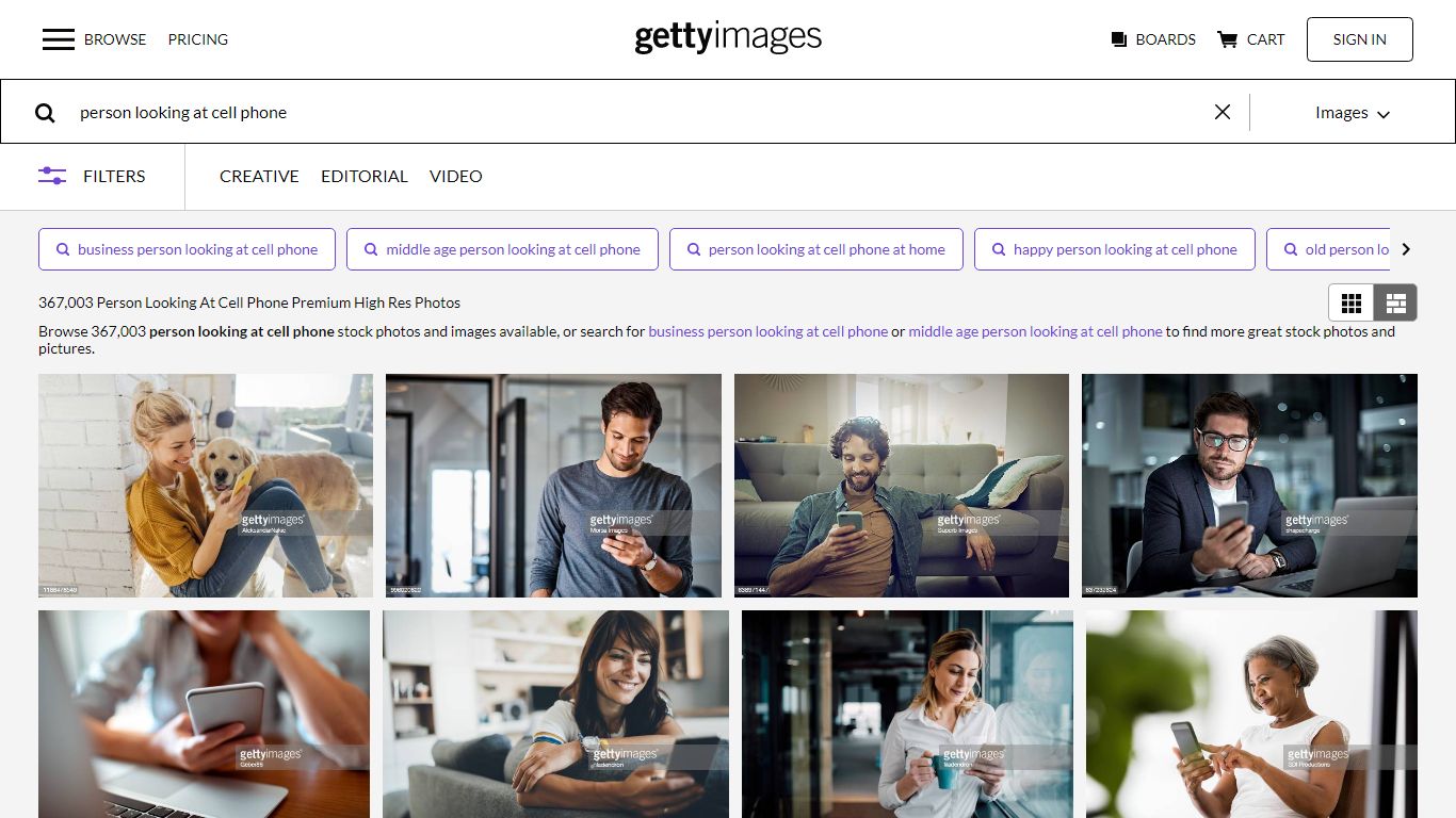 356,724 Person Looking At Cell Phone Premium High Res Photos